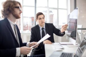 Two men in suits discussing how to Choose a Legal Process Server