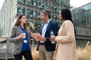 Three registered process servers in suits talking